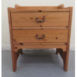 A modern honey coloured pine two frame bedside chest  24"h  21"w