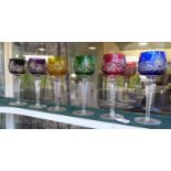 A set of six pedestal hock glasses, each with coloured or clear glass cut bowls
