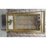 A late 19thC fully glazed giltwood and glass display cabinet with a single glazed door, surmounted