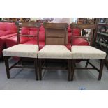 Three William IV mahogany framed bar back dining chairs, the fabric upholstered seats raised on