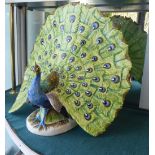 A handpainted Italian pottery model, a peacock with open tail feathers  18''h