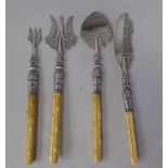 A matching set of four late Victorian items of engraved and chased silver presentation flatware,
