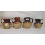 Four two tone stoneware Harvest jugs, one with a silver collar  London 1920  largest 7"h
