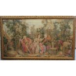 A mid 20thC Belgian design tapestry, featuring figures in a courtyard setting  36" x 65"  framed