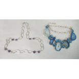 Silver and white metal necklaces, one set with blue topaz