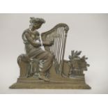 A 19thC cast brass flatback ornament, depicting a classically attired maiden, playing a harp  7"h