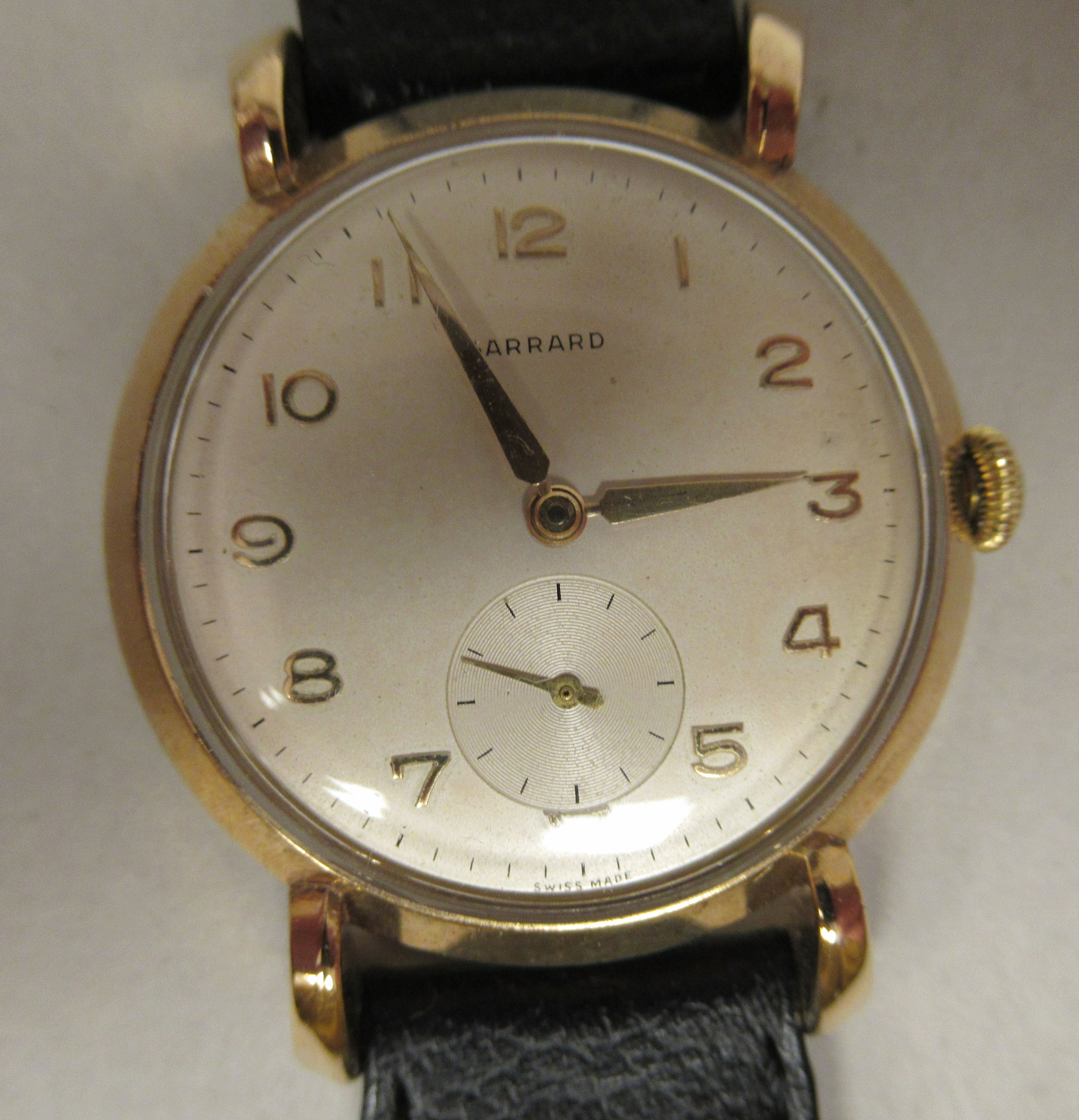 A 1950s Gerrard 9ct gold cased wristwatch, faced by an Arabic dial, incorporating subsidiary