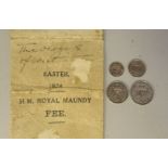 A set of four Maundy Money coins 1924 with an attendant printed envelope