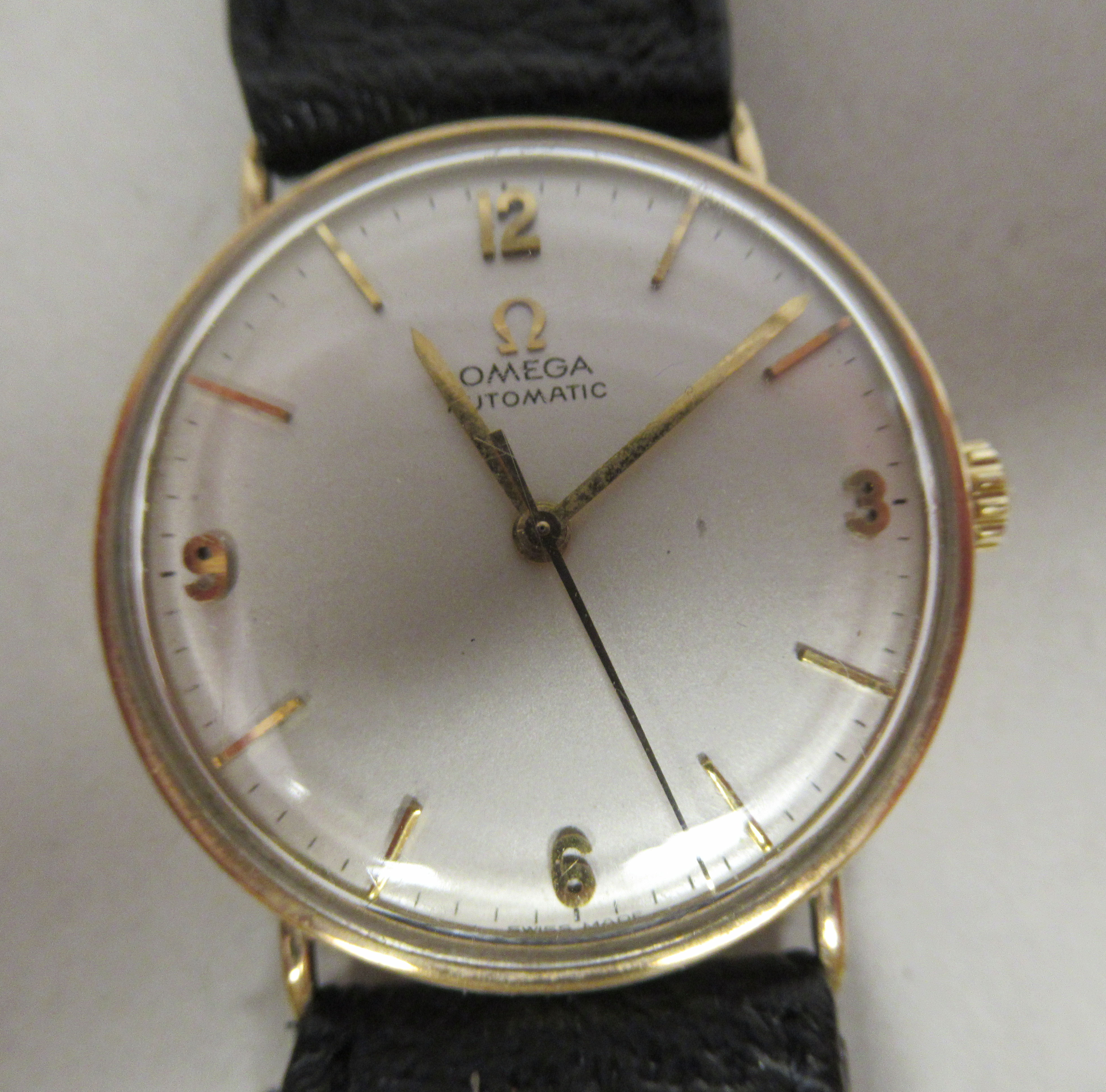 A 1950/60s Omega 9ct gold cased wristwatch, the automatic movement with sweeping seconds, faced by