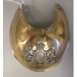 A Georgian gilt metal gorget with an applied silver coat of arms (Please Note: this lot is subject