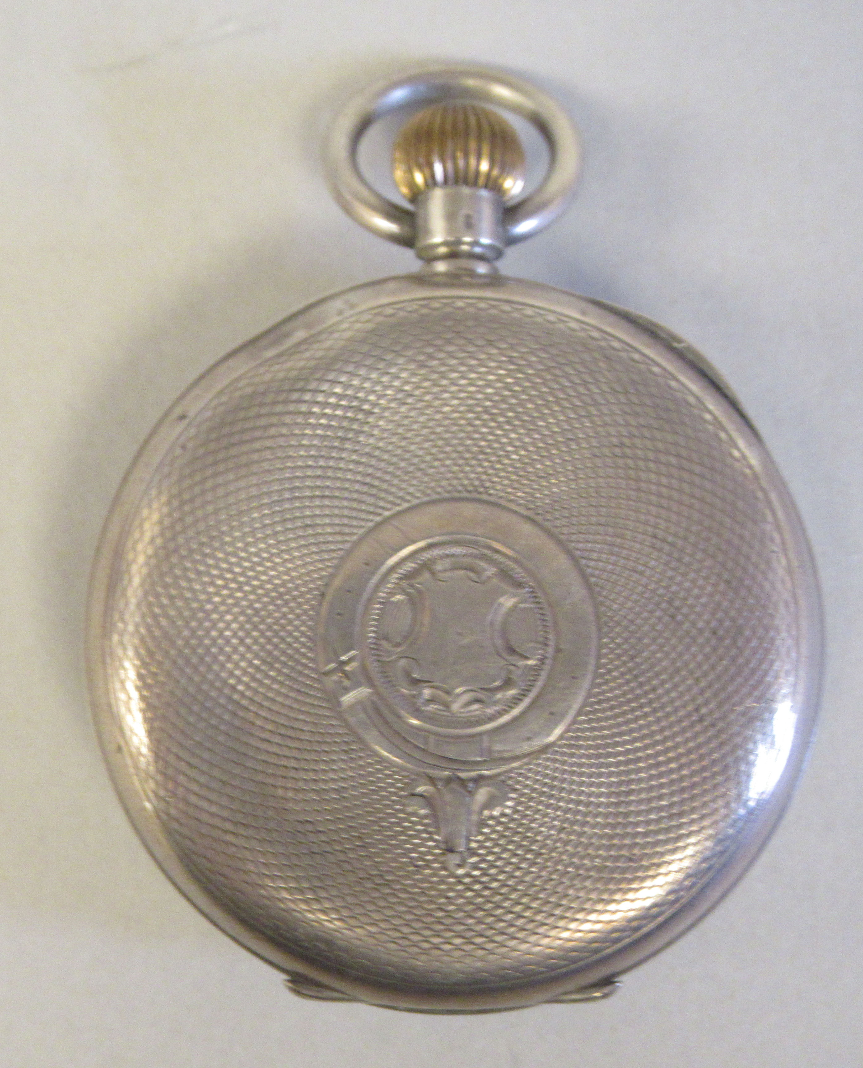 An Omega (935) silver coloured metal cased pocket watch with an engine turned back, faced by a white - Image 2 of 4