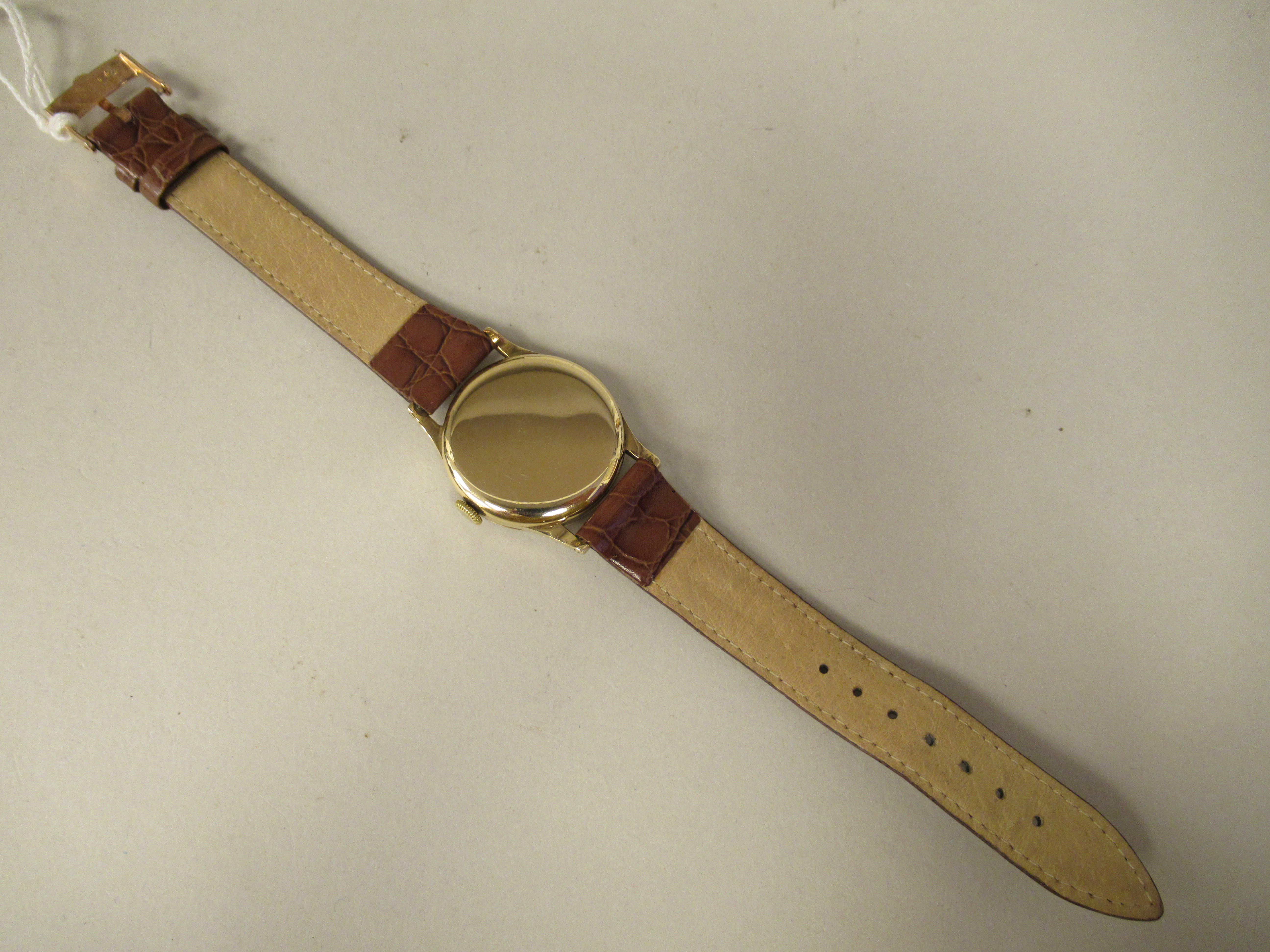 A 1957 Omega 9ct gold cased wristwatch, faced by a silvered Arabic dial, incorporating a subsidiary, - Image 3 of 3
