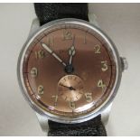 A 1930s Holvita stainless steel cased wristwatch, faced by a tinted bronze coloured Arabic dial,
