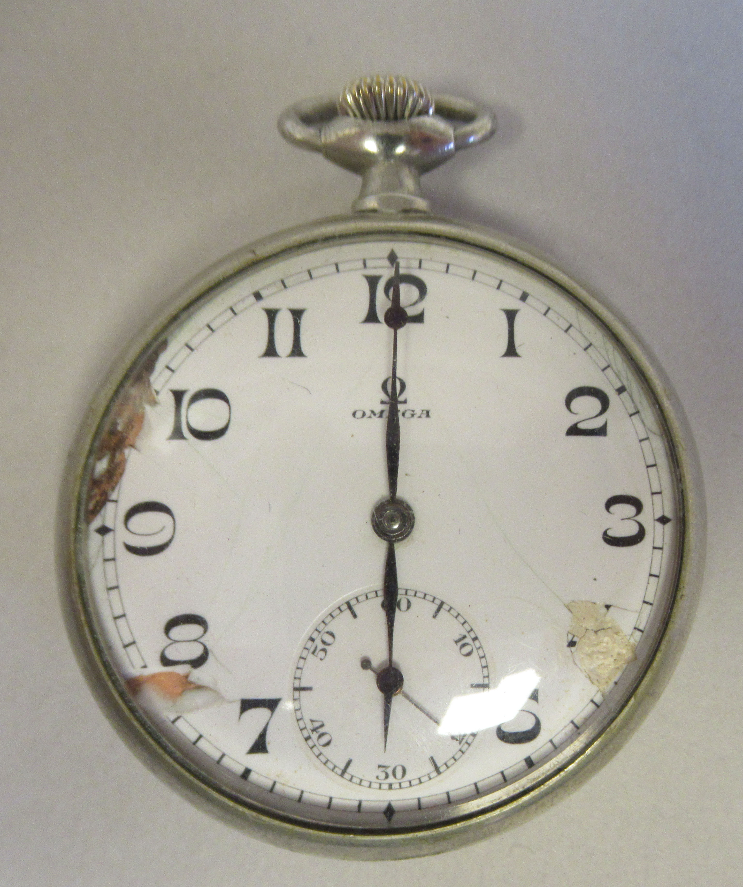 An Omega stainless steel cased pocket watch, faced by a white enamel Arabic dial, incorporating a