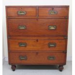 An early 20thC brass mounted, mahogany, two part military design chest with an arrangement of