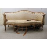 A mid 19thC serpentine outlined, enclosed, carved giltwood framed and upholstered salon settee,