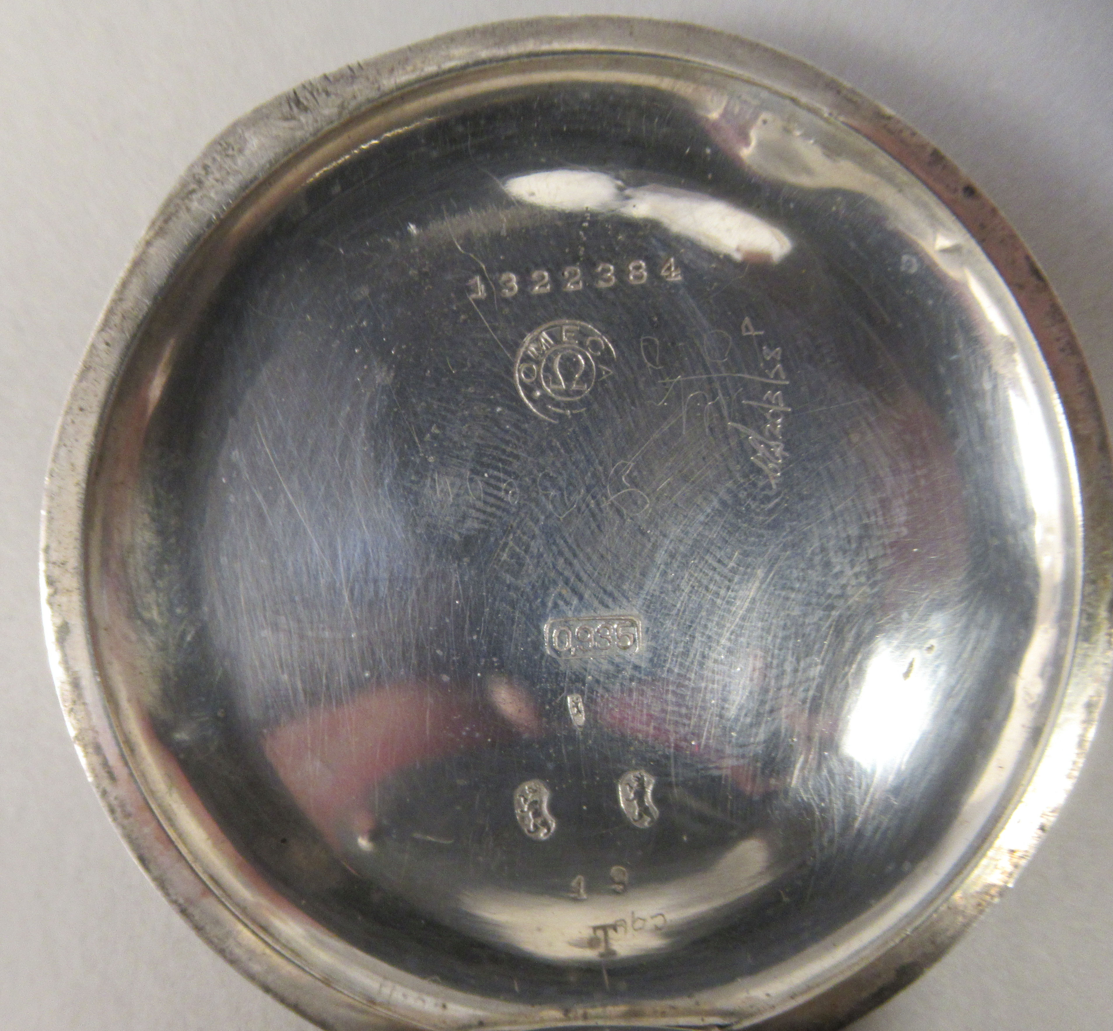 An Omega (935) silver coloured metal cased pocket watch with an engine turned back, faced by a white - Image 4 of 4