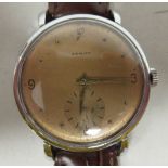 A 1940s Zenith stainless steel cased wristwatch, faced by a bronze effect Arabic and baton dial,