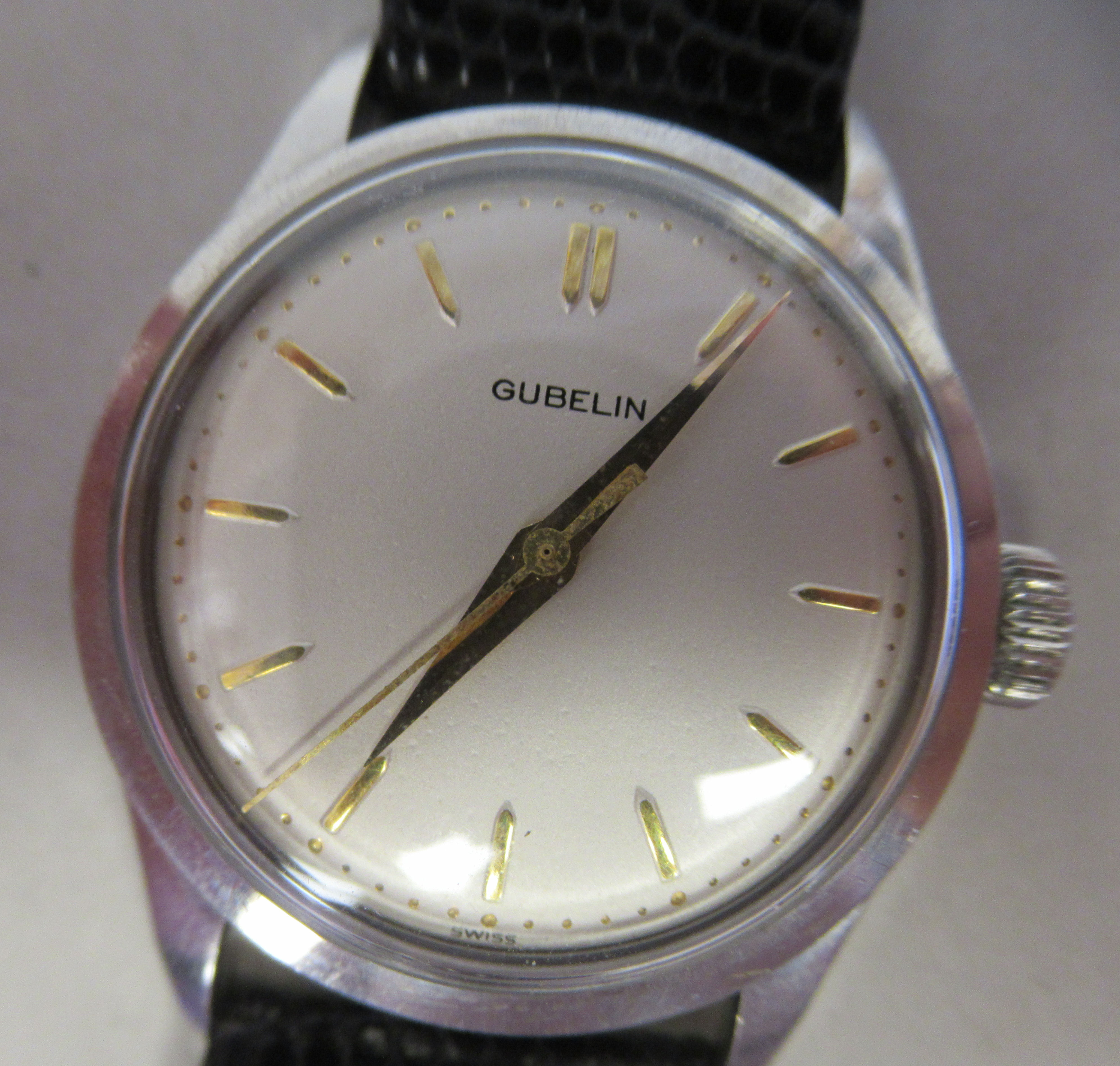 A 1958 Gubelin stainless steel cased wristwatch, the movement with sweeping seconds, faced by a