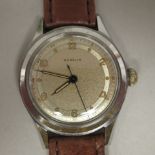 A 1950s Gublin stainless steel cased wristwatch, the movement with sweeping seconds, faced by an