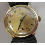 A 1930/40s Tissot 9ct gold cased wristwatch, faced by a bronze effect Arabic dial, incorporating a