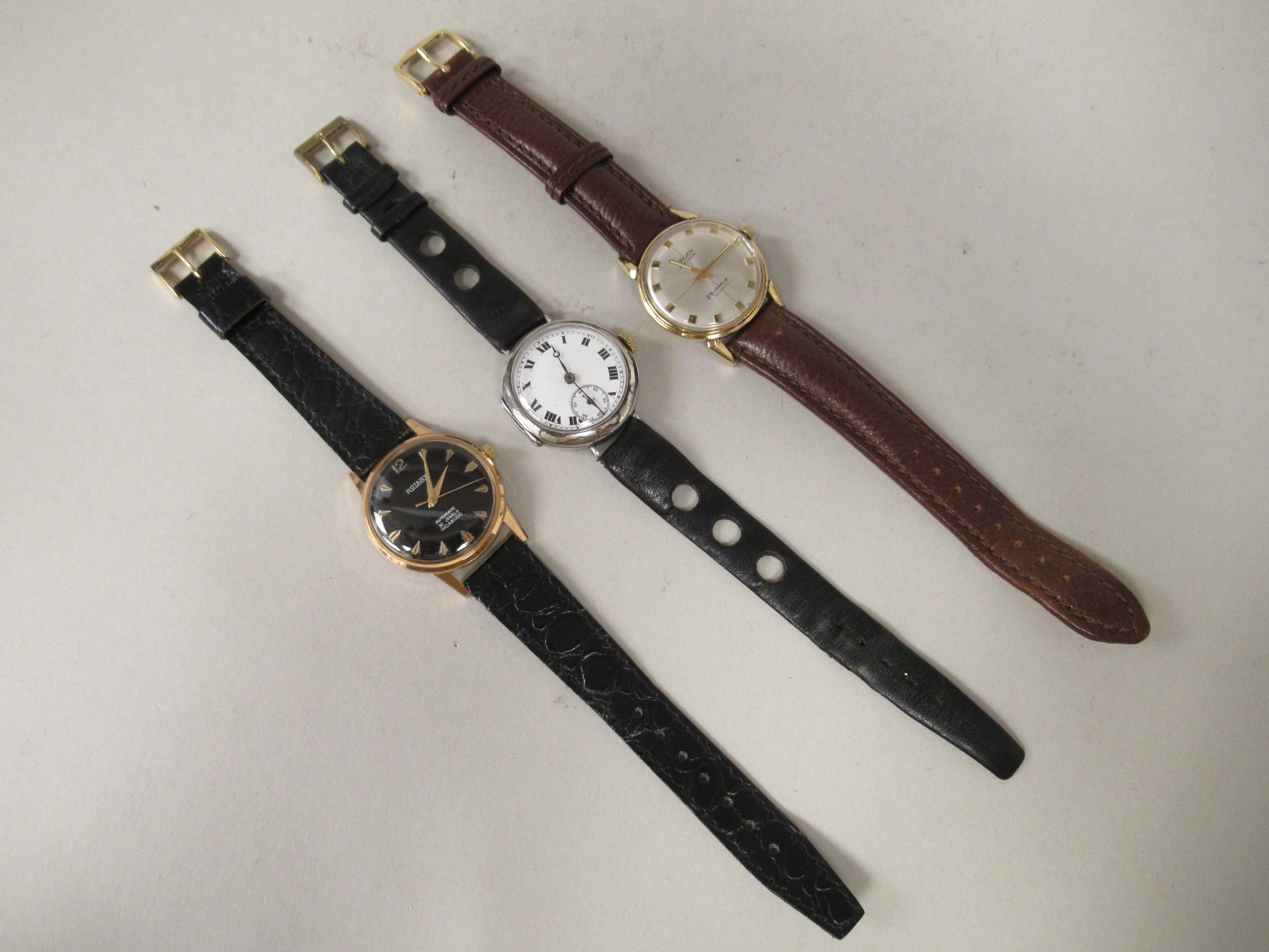 Three wristwatches, viz. a silver coloured metal cased trench watch, faced by a white enamel Roman - Image 2 of 3