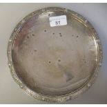 A silver dish, the shallow bowl with a cast Celtic design border, on a plain footrim  Reid & Sons