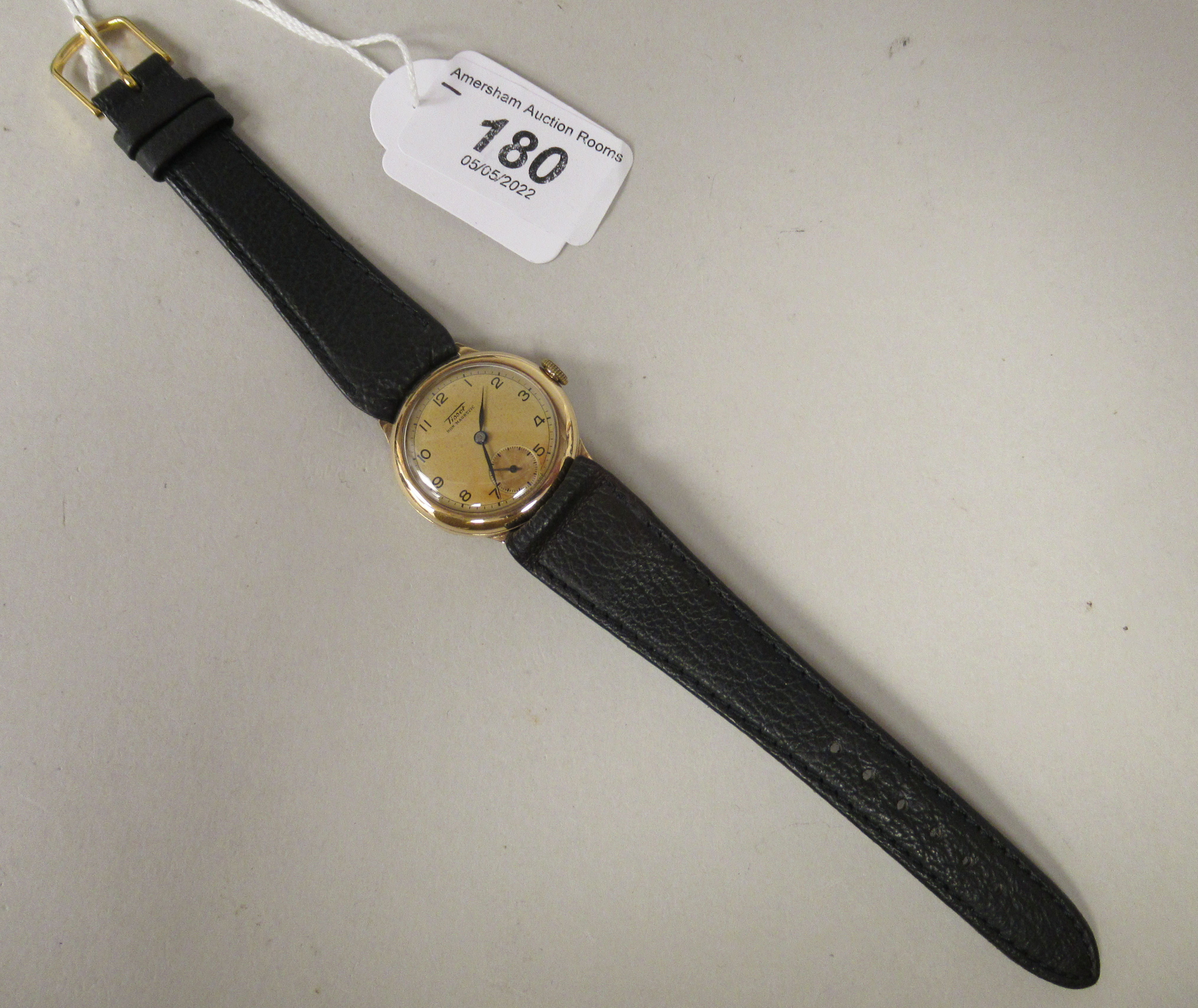 A 1930/40s Tissot 9ct gold cased wristwatch, faced by a bronze effect Arabic dial, incorporating a - Image 2 of 3