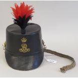 A black hide covered shako with a chain chinstrap, black and red feathered plume  (Please Note: this