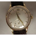 A 1950s Omega 9ct gold cased wristwatch, faced by a baton dial, incorporating a subsidiary, on a