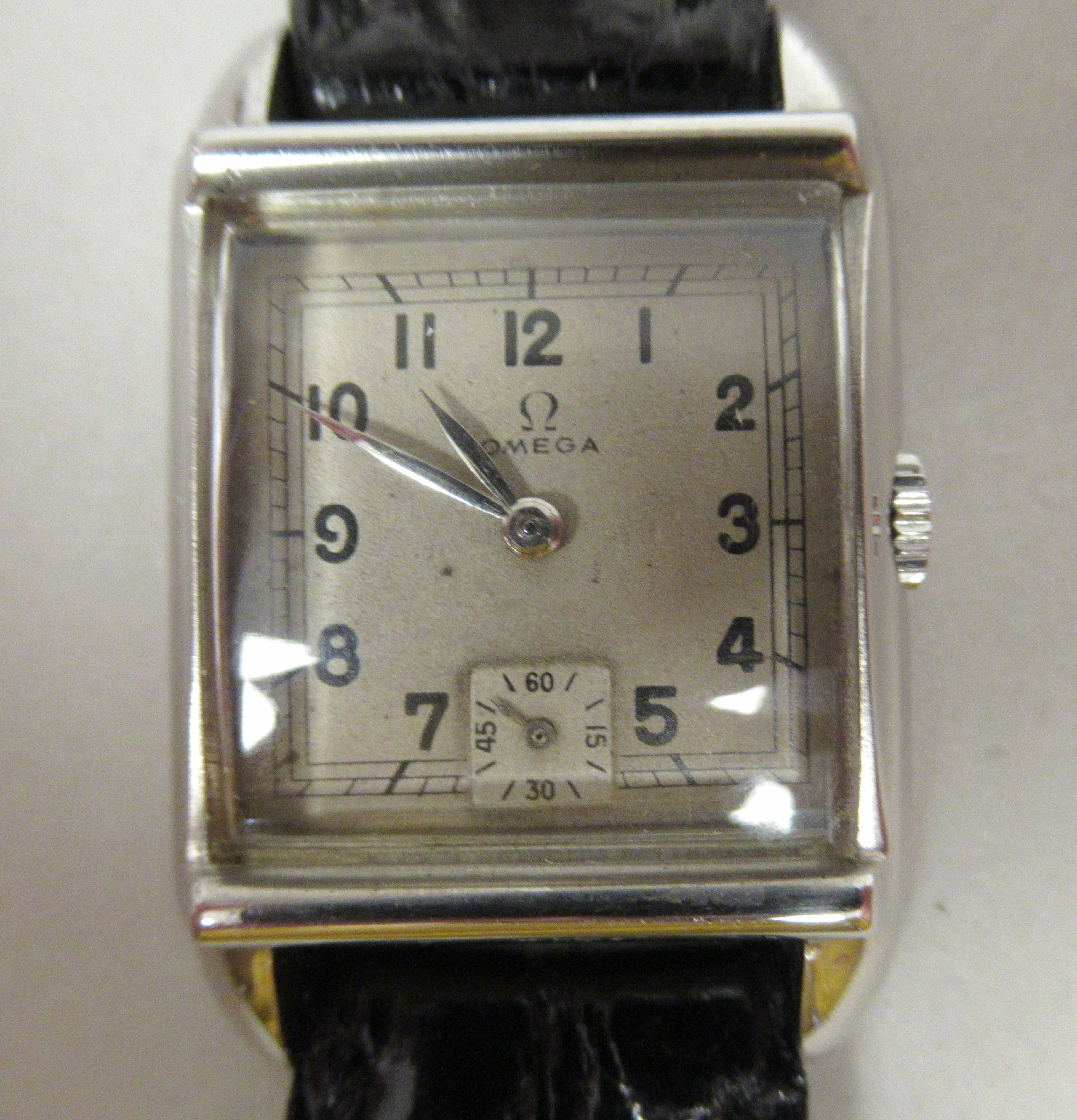 A 1950s Omega Art Deco stainless steel cased mid-size wristwatch, faced by an Arabic dial,