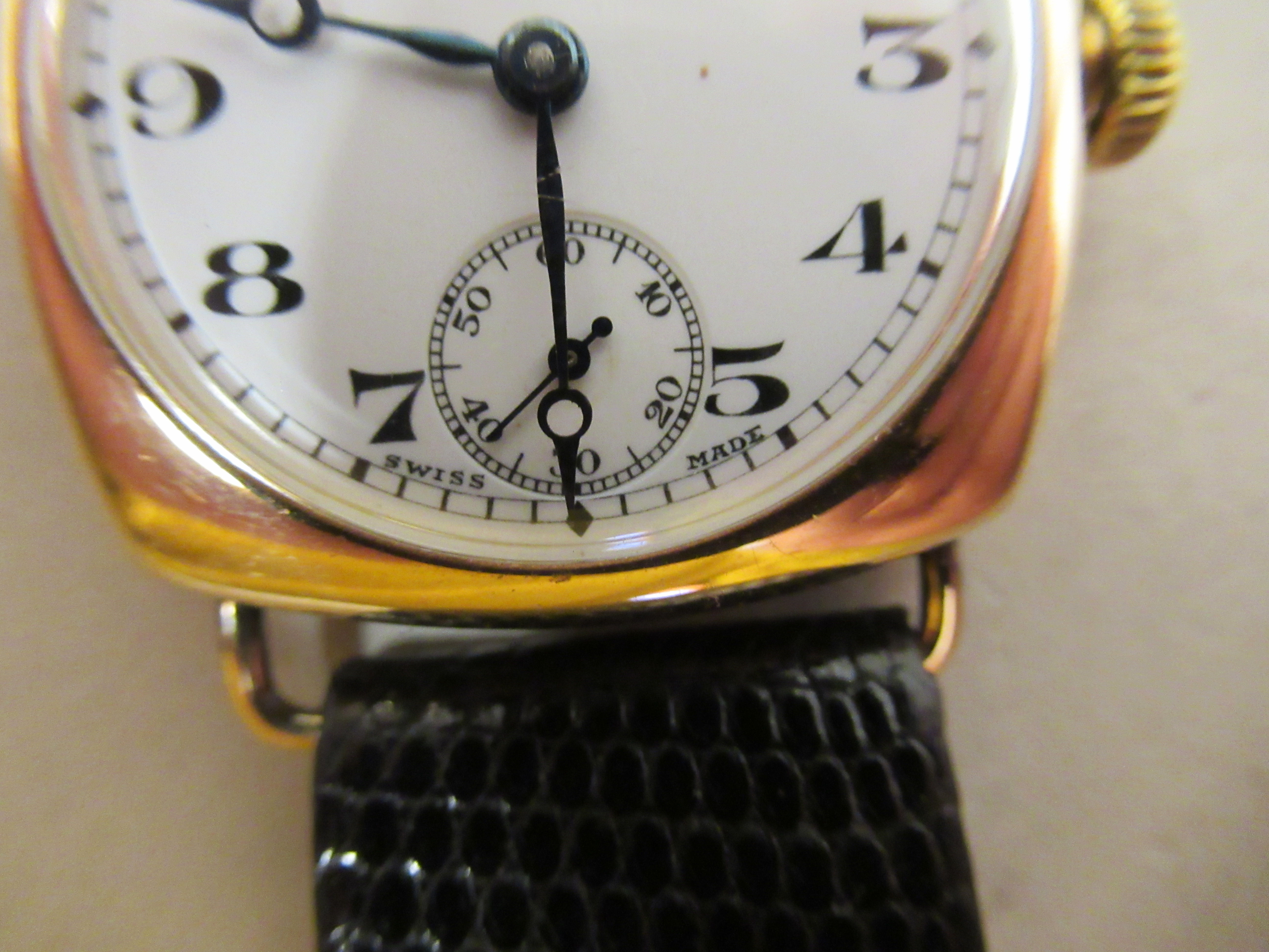 A 1930/40s Omega 9ct gold cushion cased wristwatch, faced by a white enamel Arabic dial, - Image 3 of 6