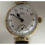 A 1920/30s lady's Omega 9ct gold cased wristwatch, faced by a white enamel Arabic dial,