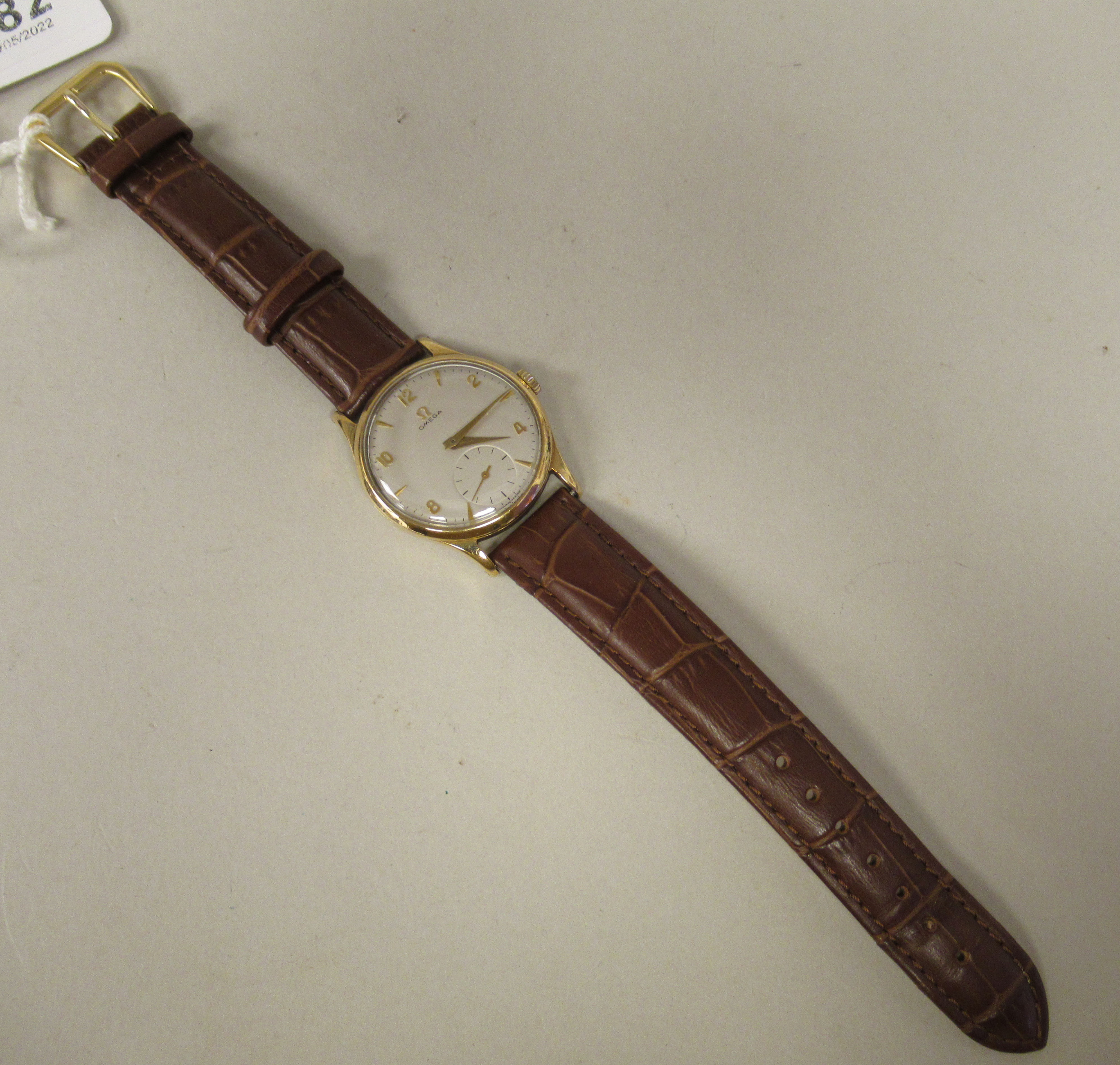 A 1950s Omega 'Big Bumper' 9ct gold cased wristwatch, faced by an Arabic and baton dial, - Image 2 of 4