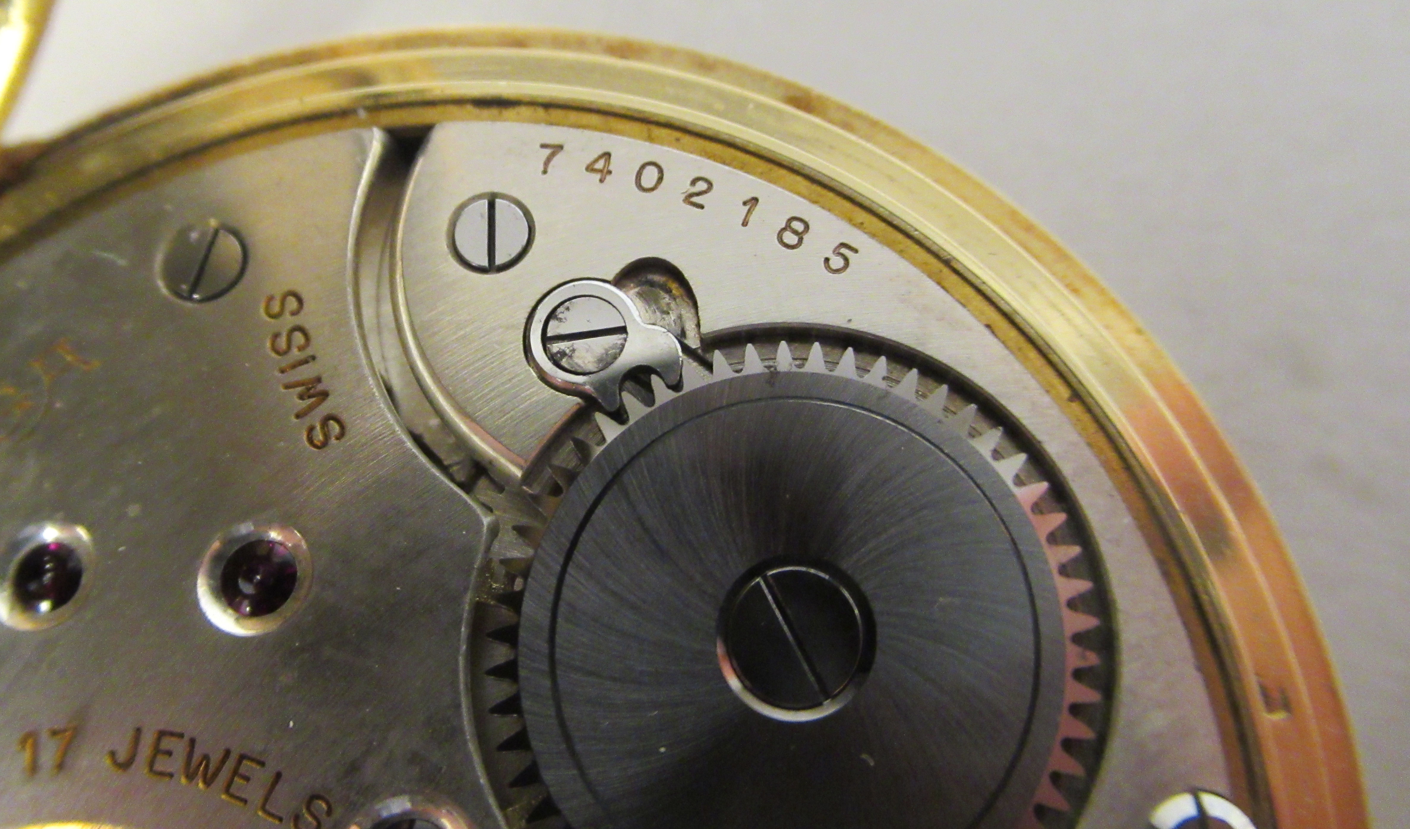 An Omega 18ct gold cased pocket watch with an engine turned back, faced by a white enamel Arabic - Image 4 of 6