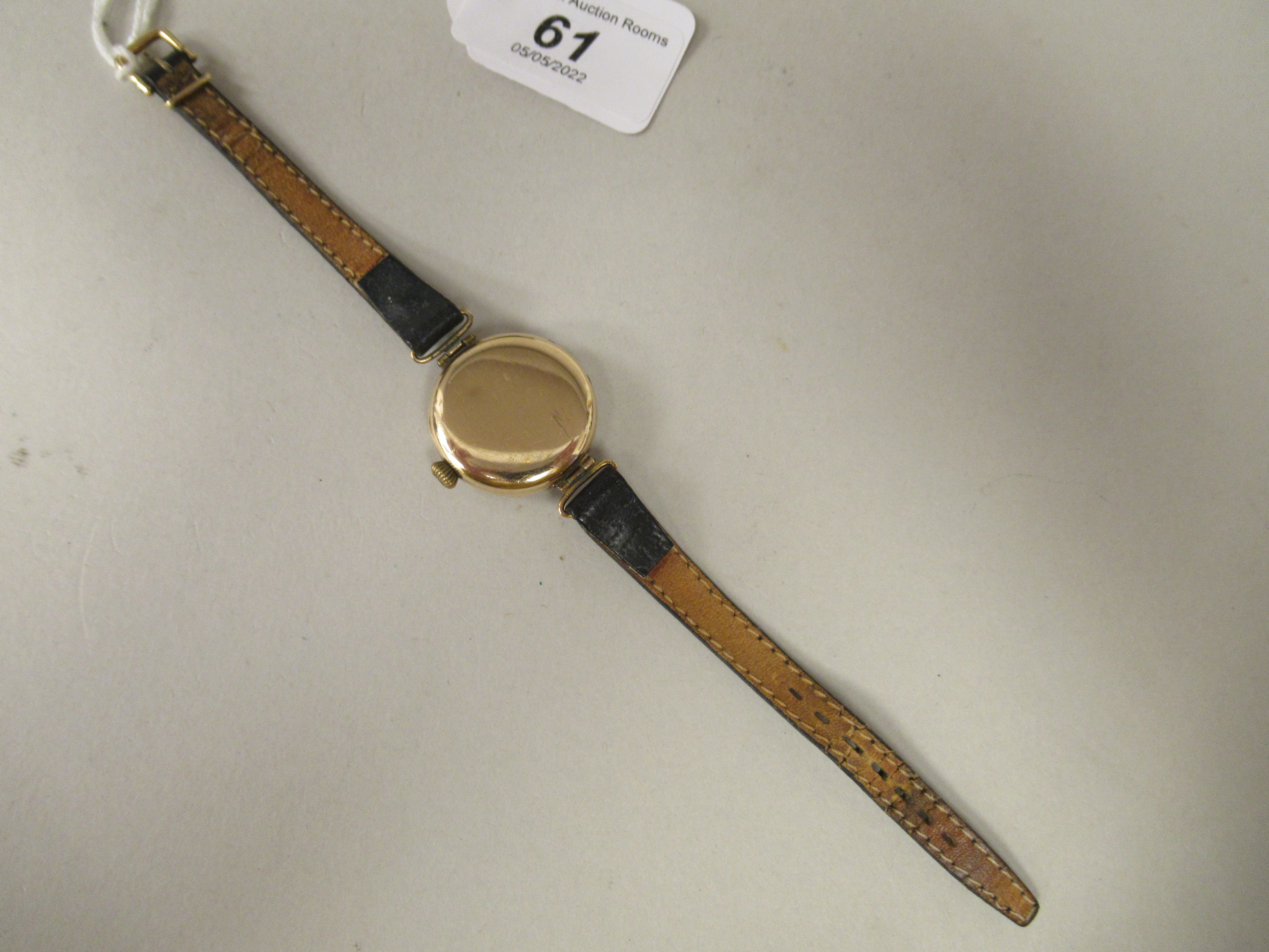 A 1920/30s lady's Omega 9ct gold cased wristwatch, faced by a white enamel Arabic dial, - Image 3 of 3