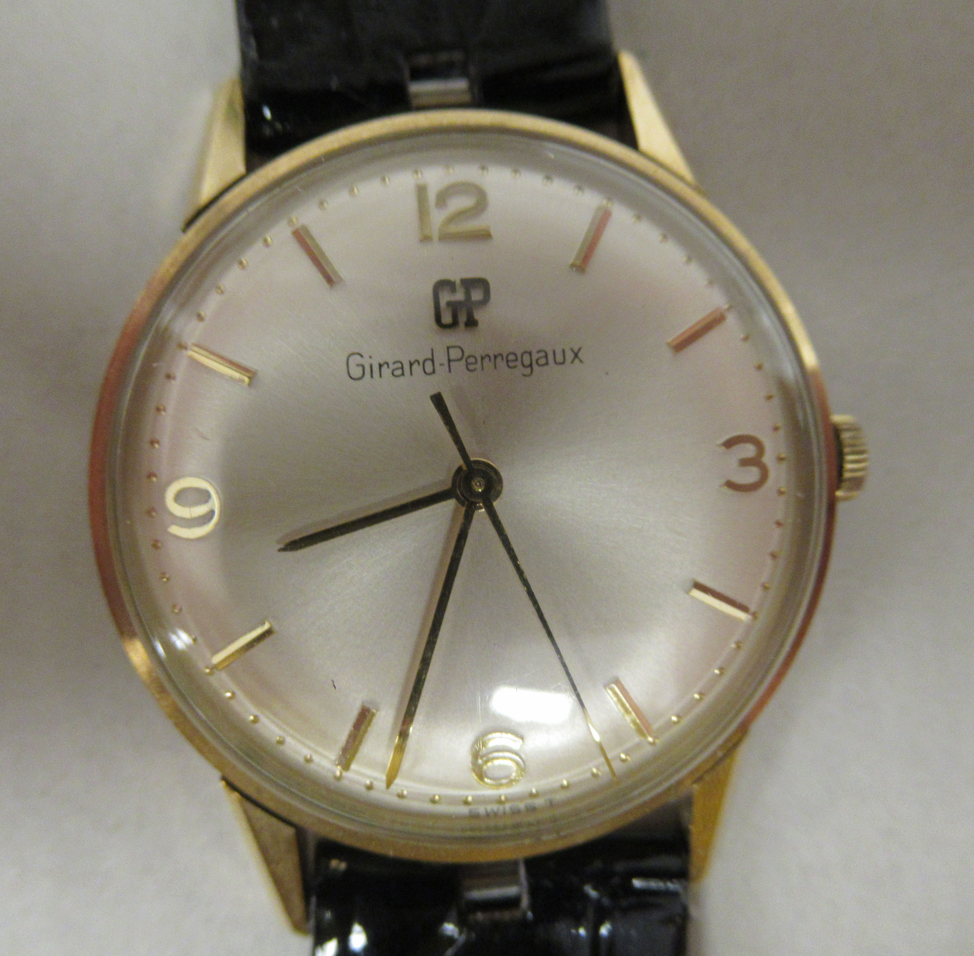 A 1960s Girard-Perregaux 9ct gold cased wristwatch, the movement with sweeping seconds, faced by a