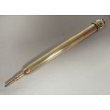 A Cartier of London 9ct gold cased propelling pencil with a suspension ring