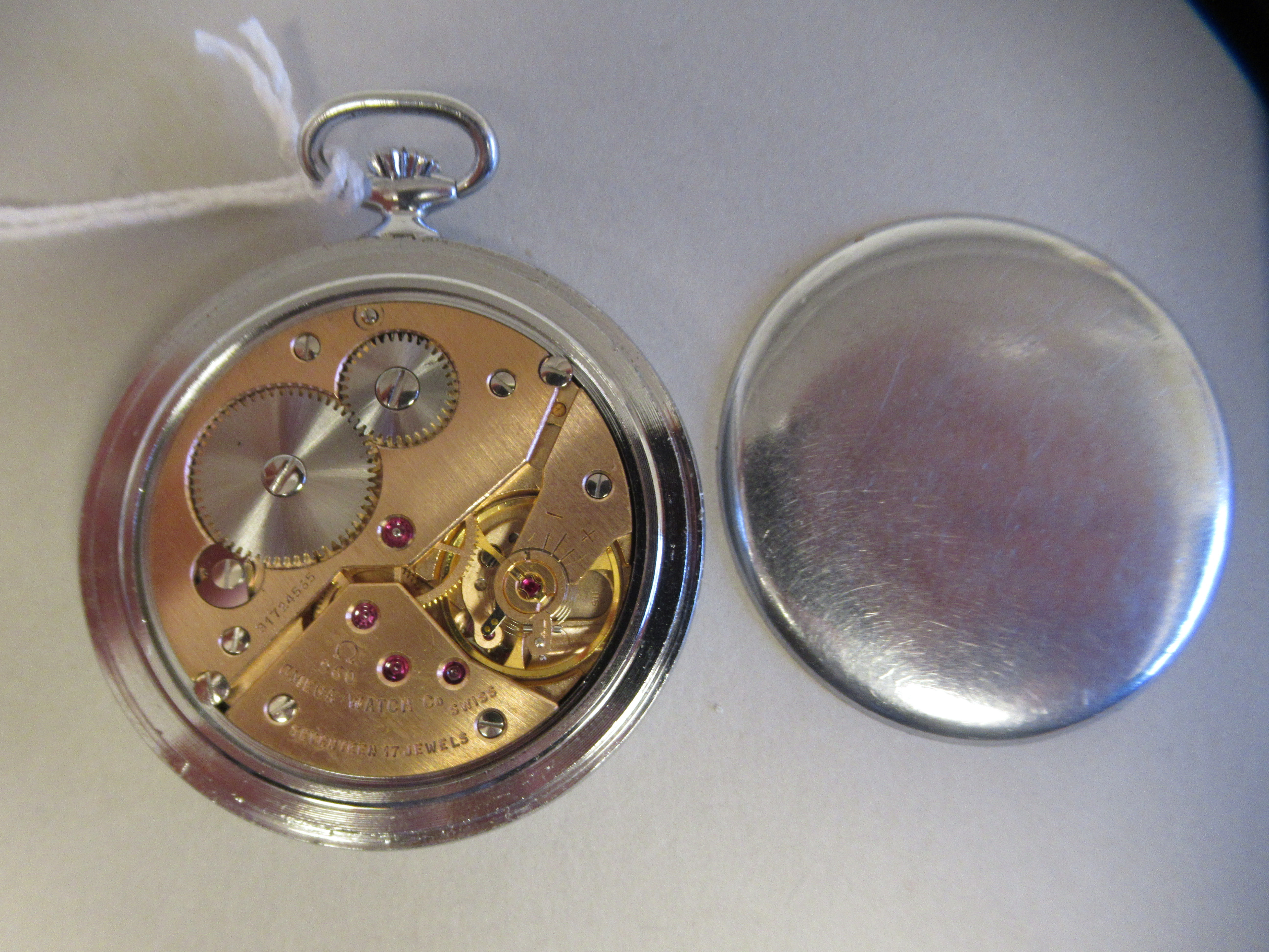 An Omega stainless steel slim cased pocket watch, faced by a white enamel Arabic dial, incorporating - Image 3 of 3