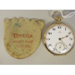 An Omega 18ct gold cased pocket watch with a radiating engraved back, faced by a white enamel Arabic
