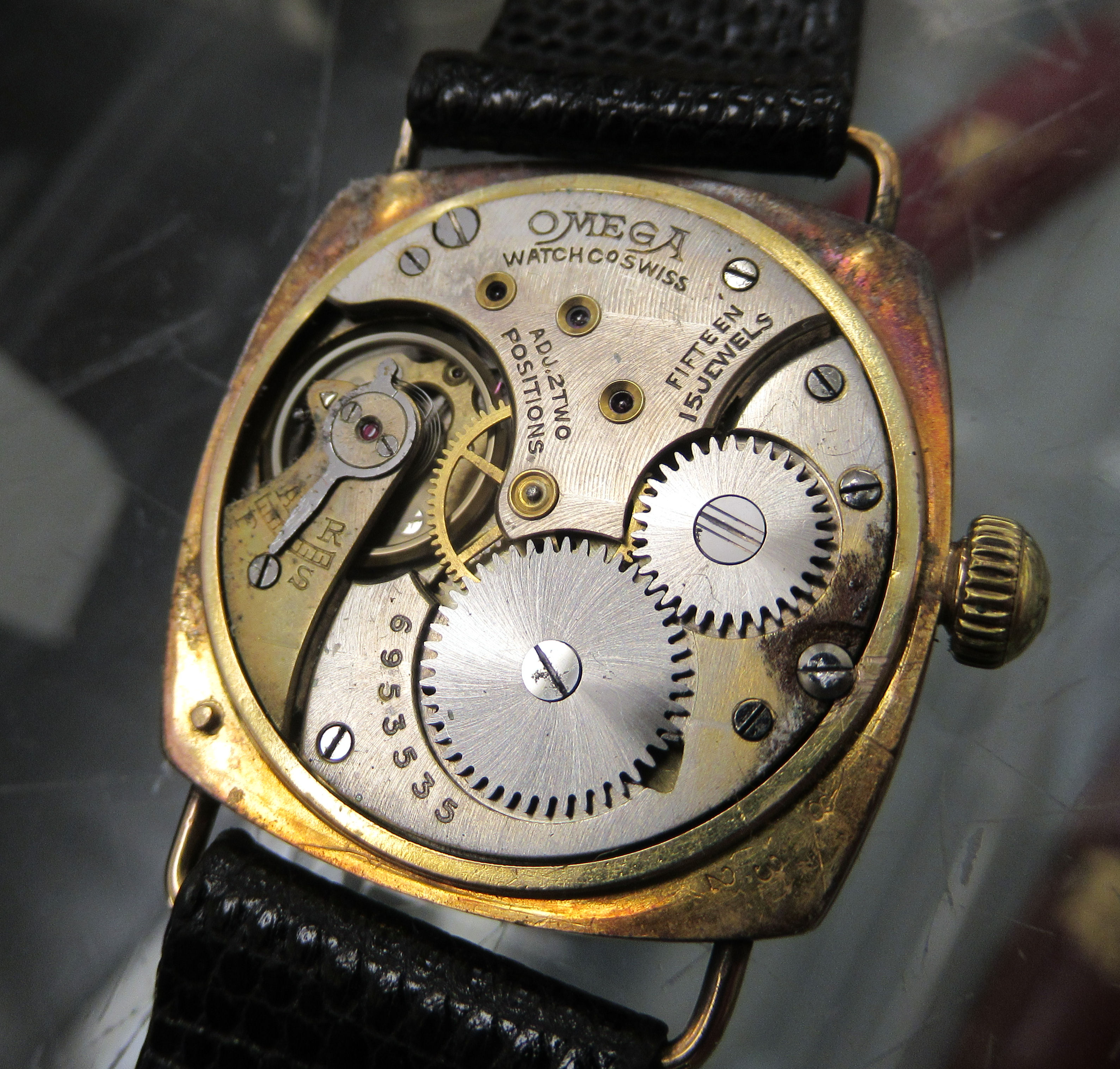 A 1930/40s Omega 9ct gold cushion cased wristwatch, faced by a white enamel Arabic dial, - Image 5 of 6