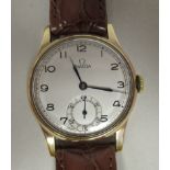A 1957 Omega 9ct gold cased wristwatch, faced by a silvered Arabic dial, incorporating a subsidiary,