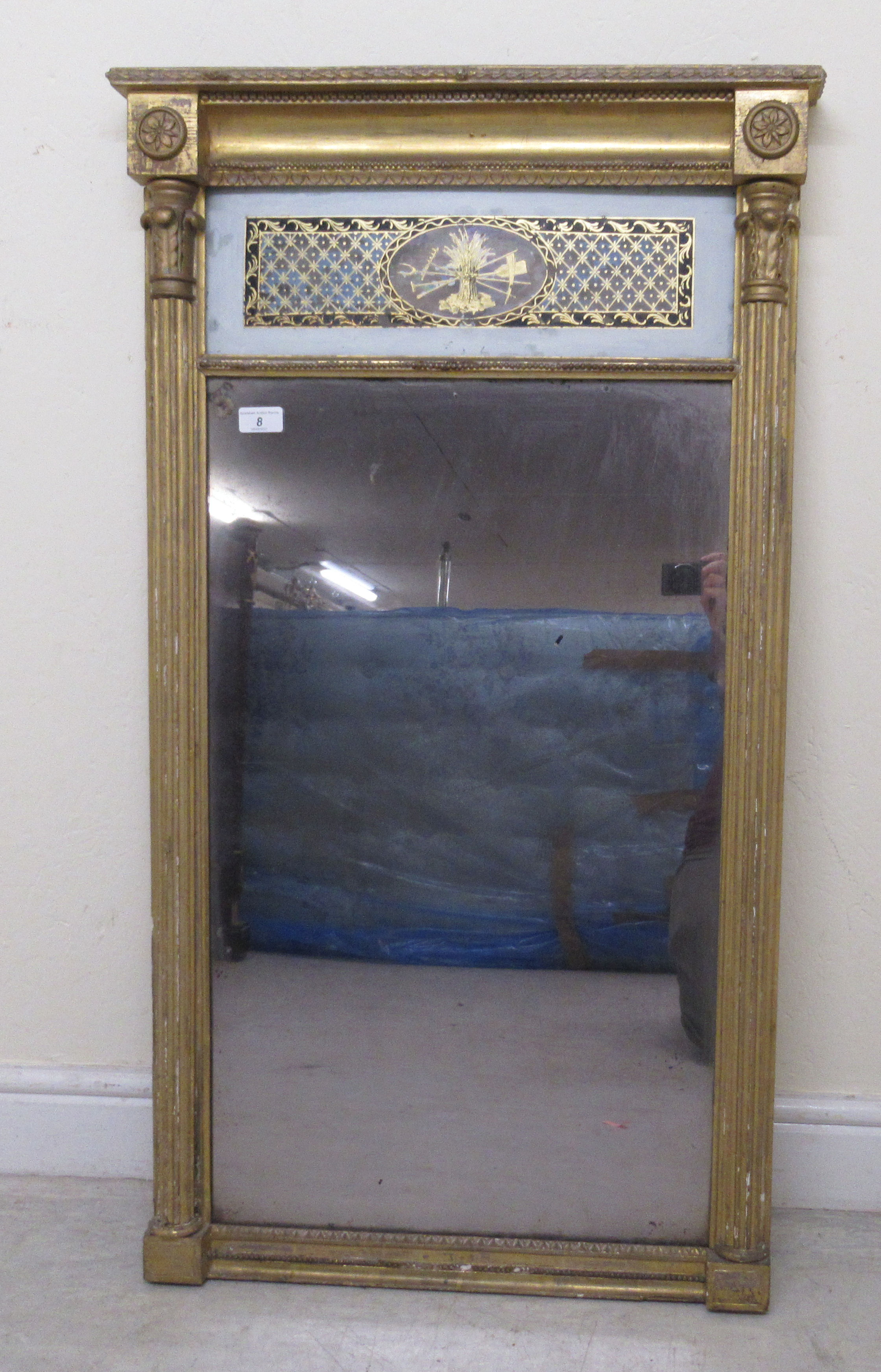 An early Victorian pier glass, set in a carved gilt gesso frame and incorporating a black painted