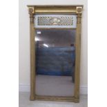 An early Victorian pier glass, set in a carved gilt gesso frame and incorporating a black painted