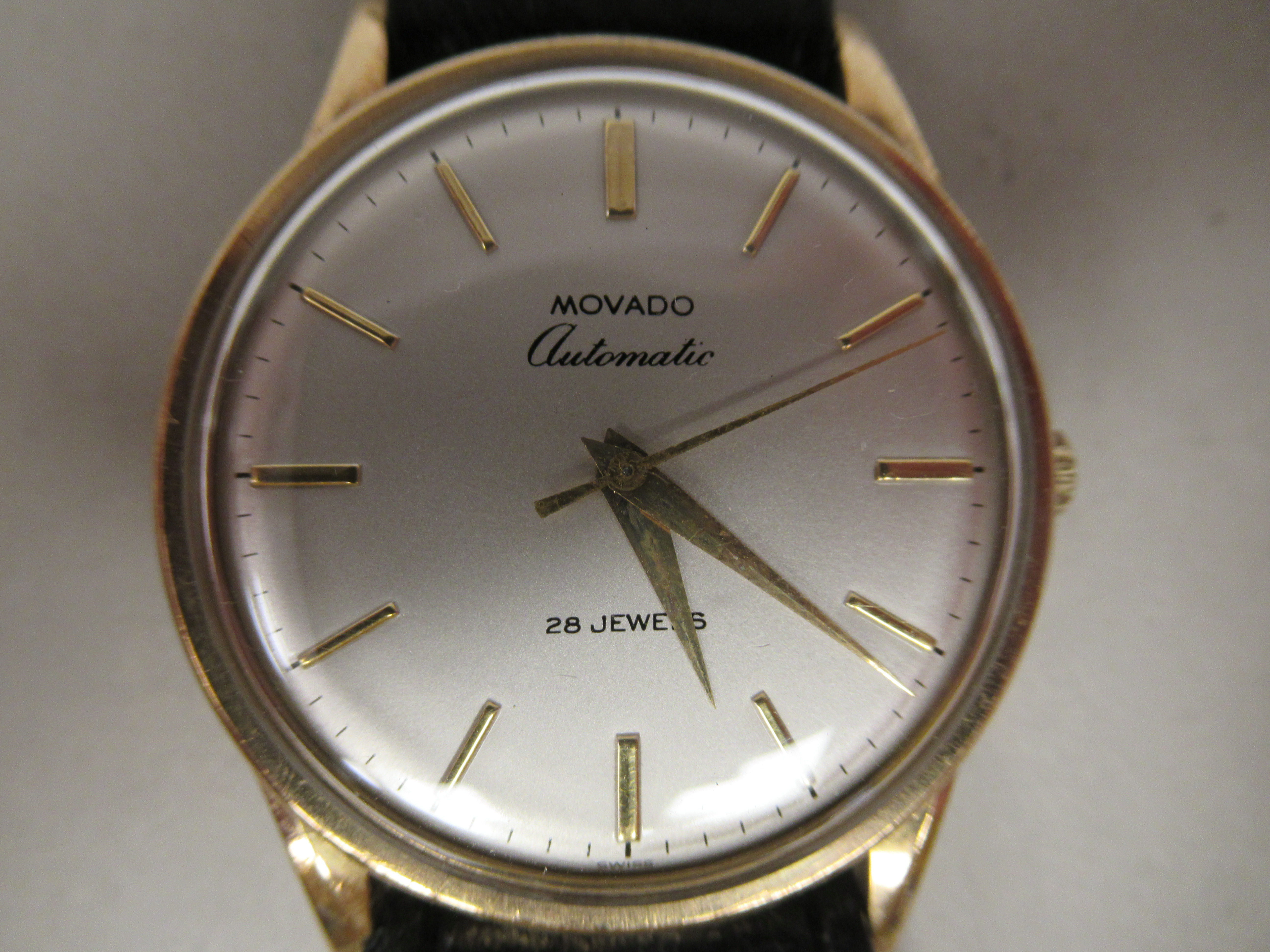 A Movado 9ct gold cased wristwatch, the 28 jewel automatic movement with sweeping seconds, faced