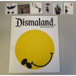 A printed copy of 'Dismaland, Bemusement Park'