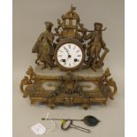 A late 19thC French gilded spelter and grey alabaster cased mantel clock, surmounted by two figures,
