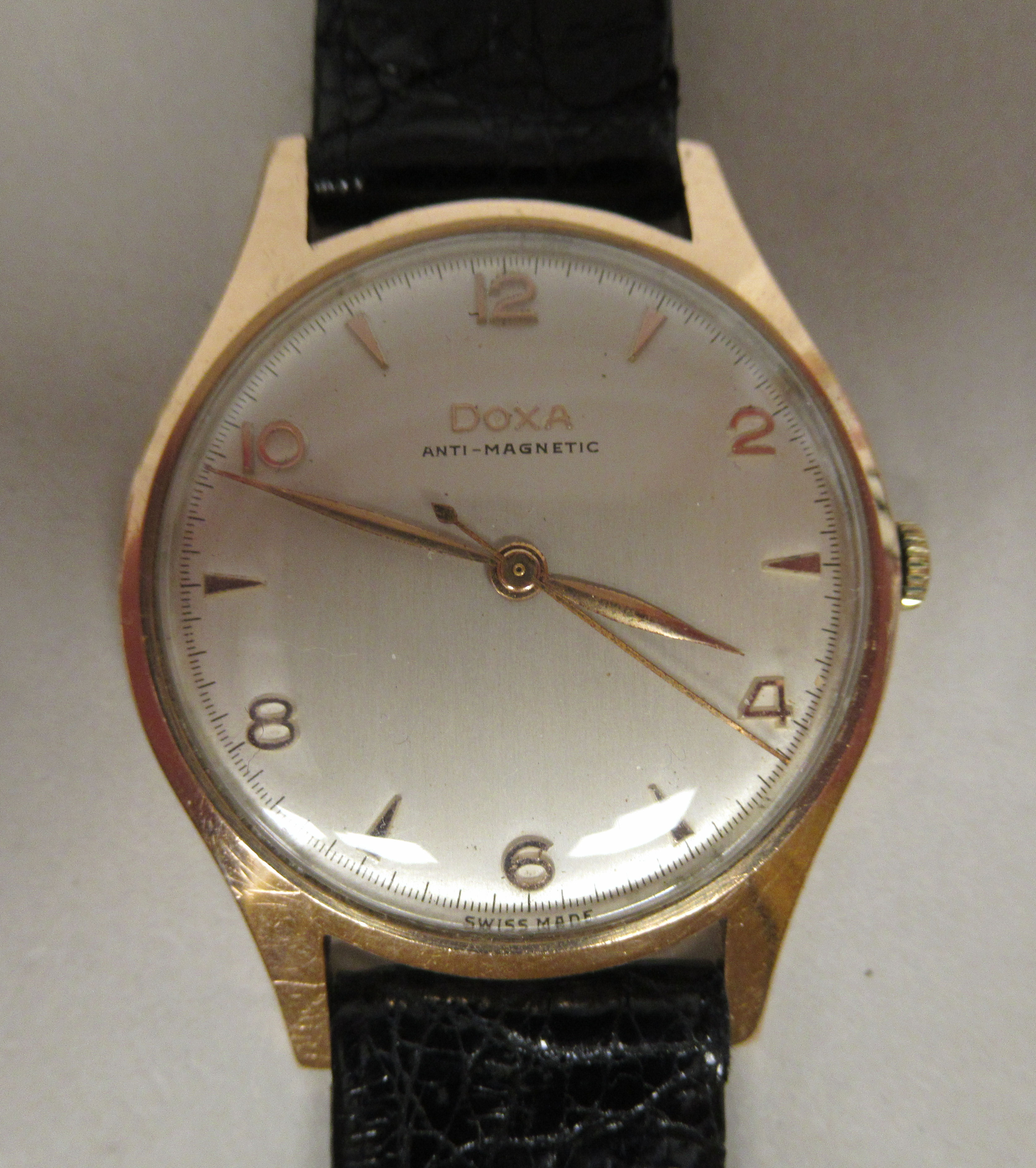 A 1960s Doxa 14ct gold cased wristwatch, the movement with sweeping seconds, faced by an Arabic