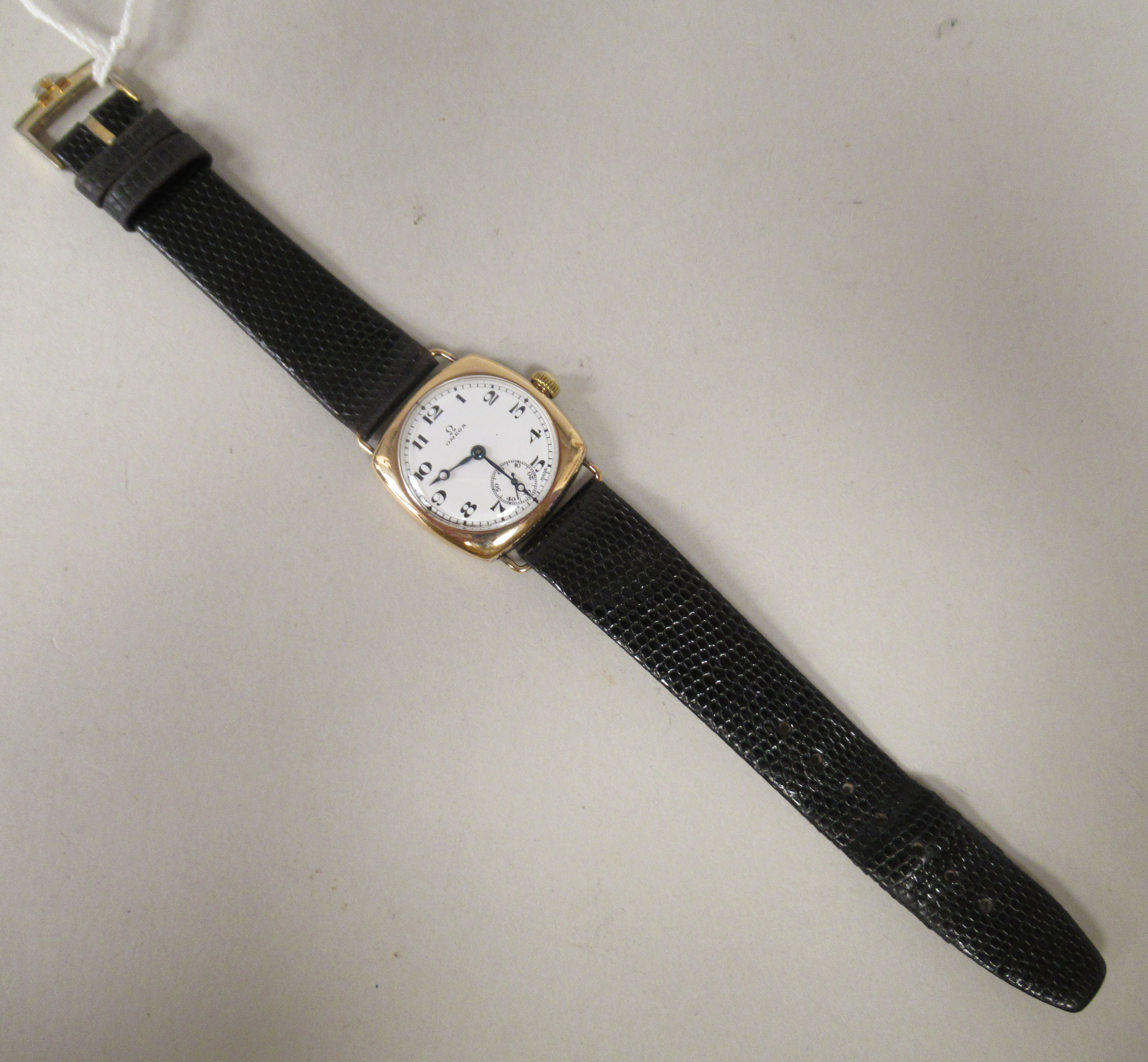 A 1930/40s Omega 9ct gold cushion cased wristwatch, faced by a white enamel Arabic dial, - Image 2 of 6