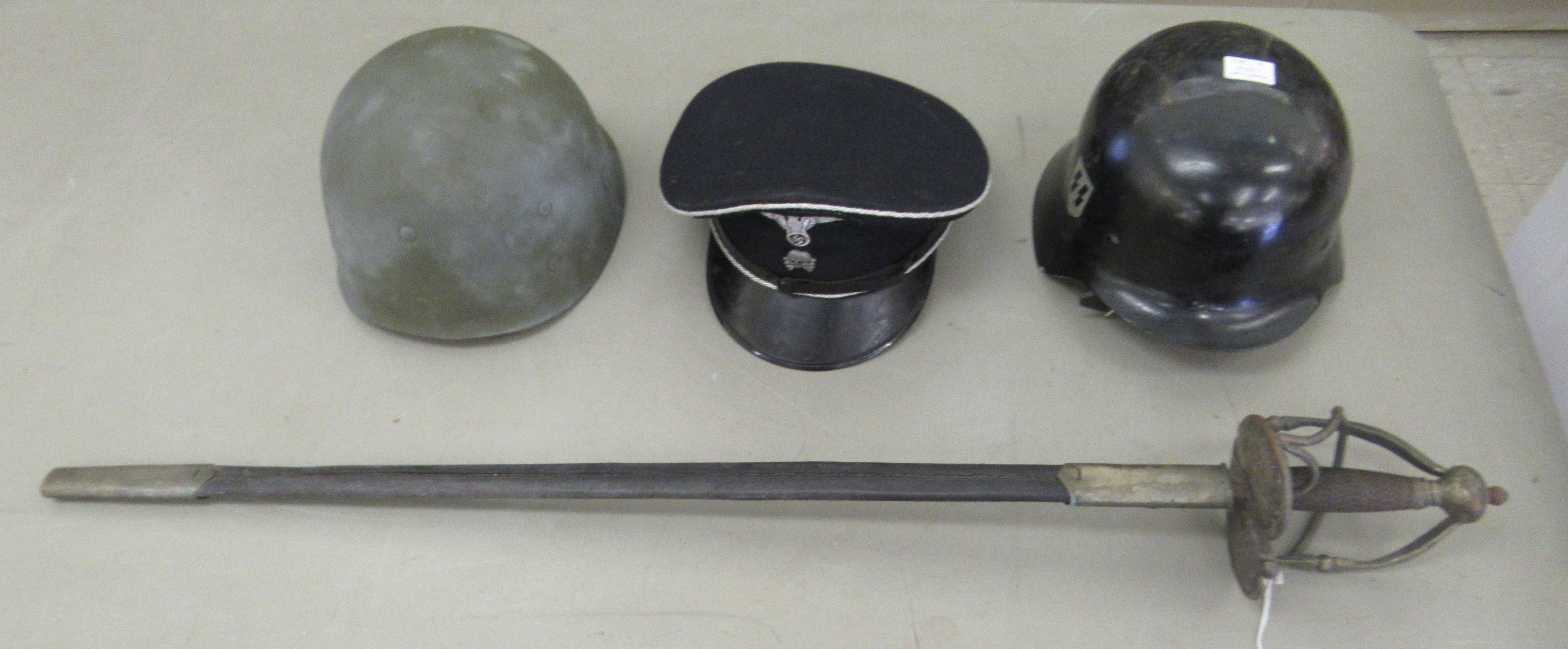 Replica militaria, viz. a 19thC style sword with a basket hilt  the blade 31"L in a scabbard; two